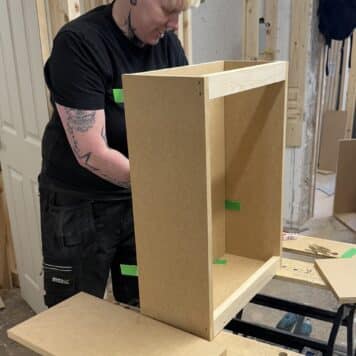 Lady building a cabinet on carpentry course