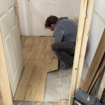 Person fitting laminate flooring