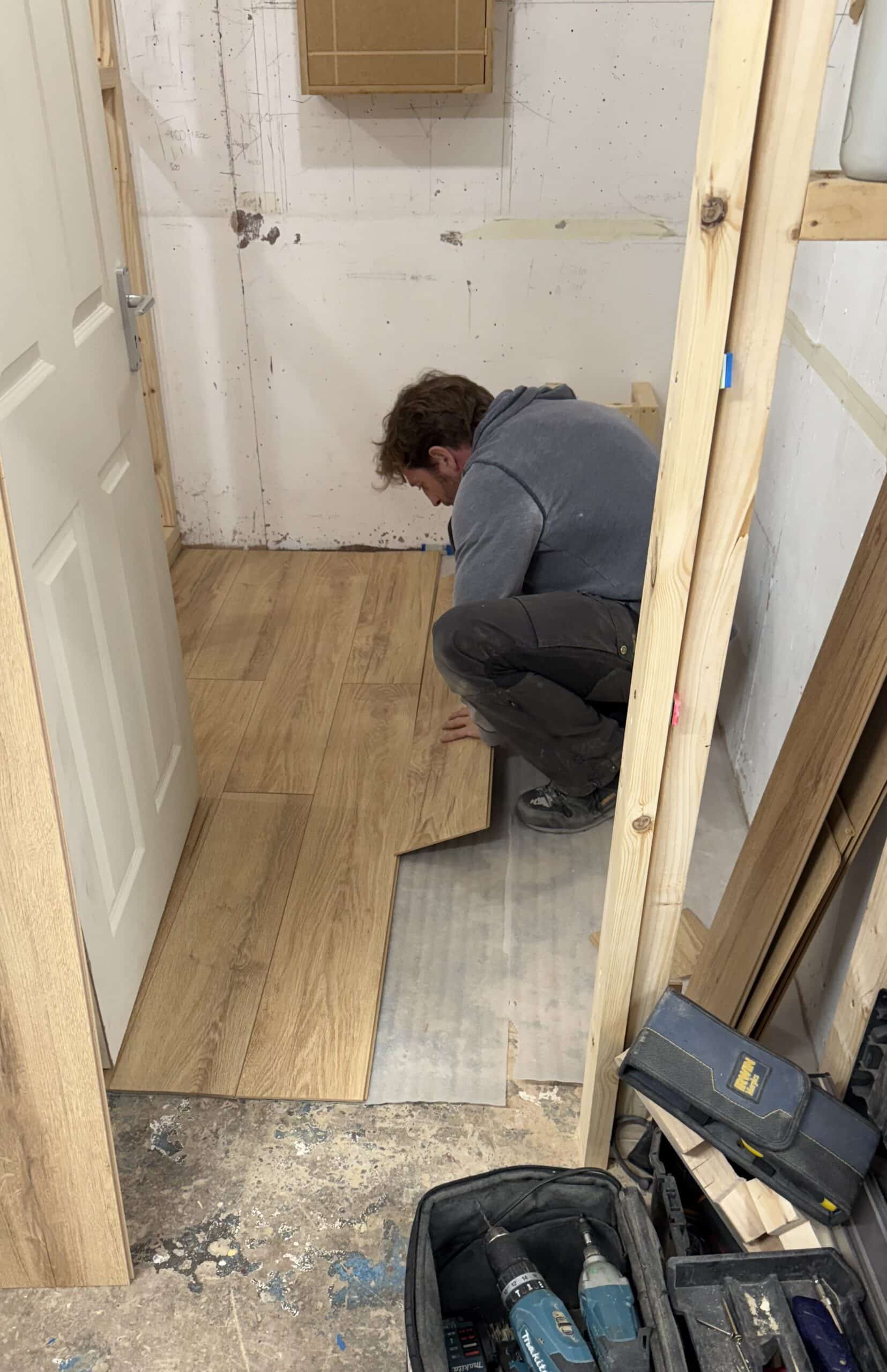 Person fitting laminate flooring