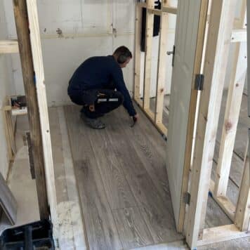 Person fitting laminate flooring