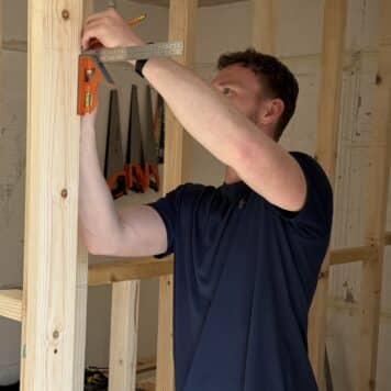 Person measuring ready to cut out for hinge