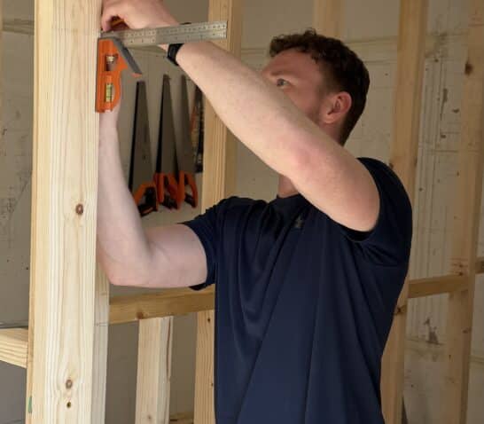 Person measuring ready to cut out for hinge