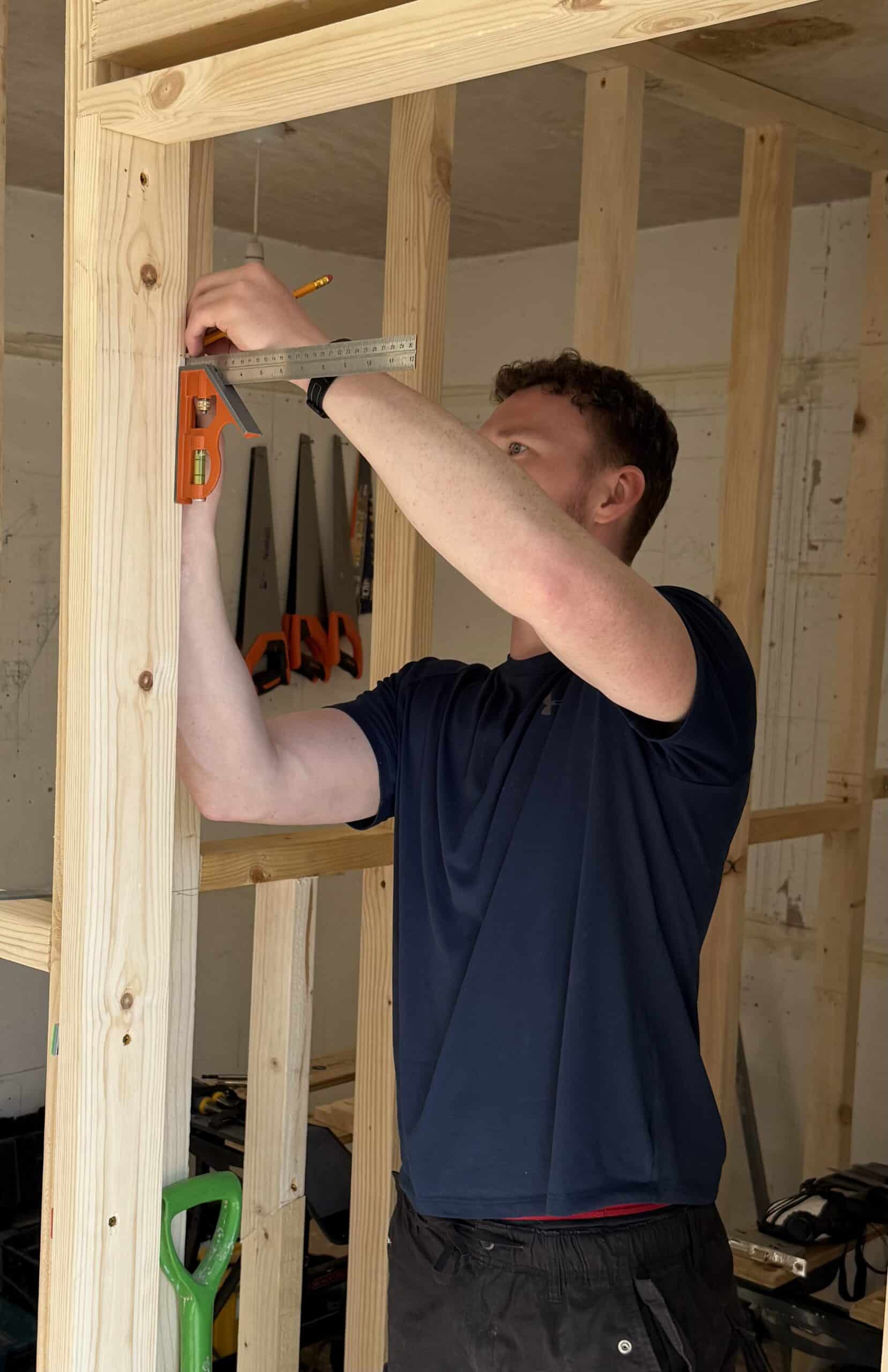 Person measuring ready to cut out for hinge