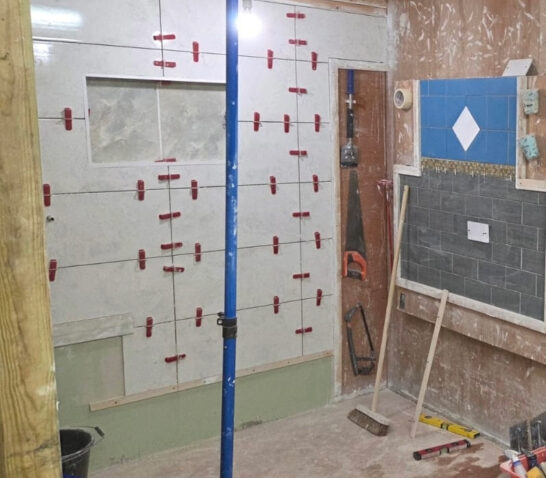 Spacious individual tiling training bays at Construction Skills College