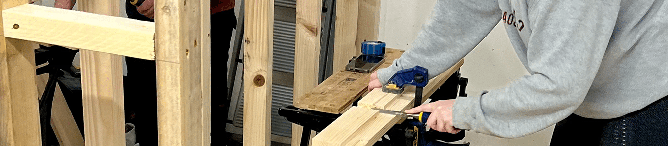 lady using a chisel on a door casing head