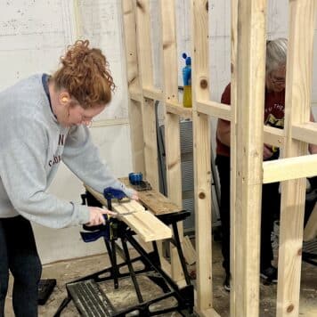 lady cutting an untrenched door casing