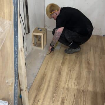 lady fitting laminate flooring