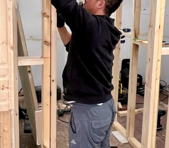 person cutting hinge recess for door