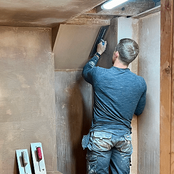 person learning to be a plasterer