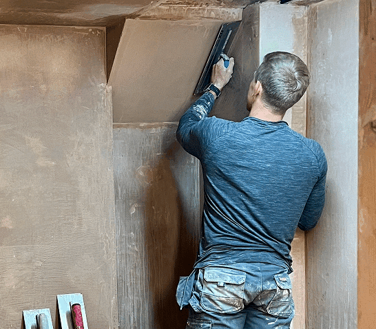 person learning to be a plasterer
