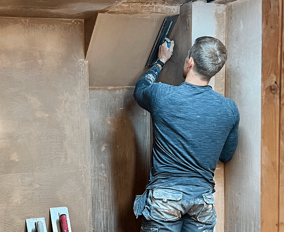 person learning to be a plasterer