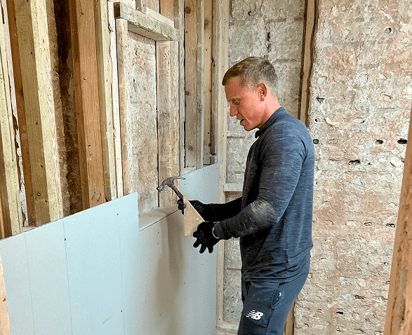 plasterboards fitted to the bottom half of the training bay window wall