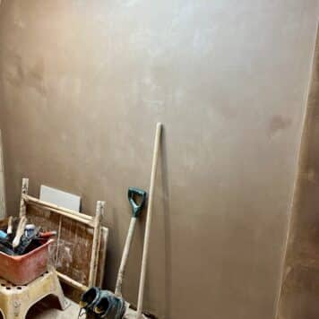 a plastered wall over skimmed on the plastering course