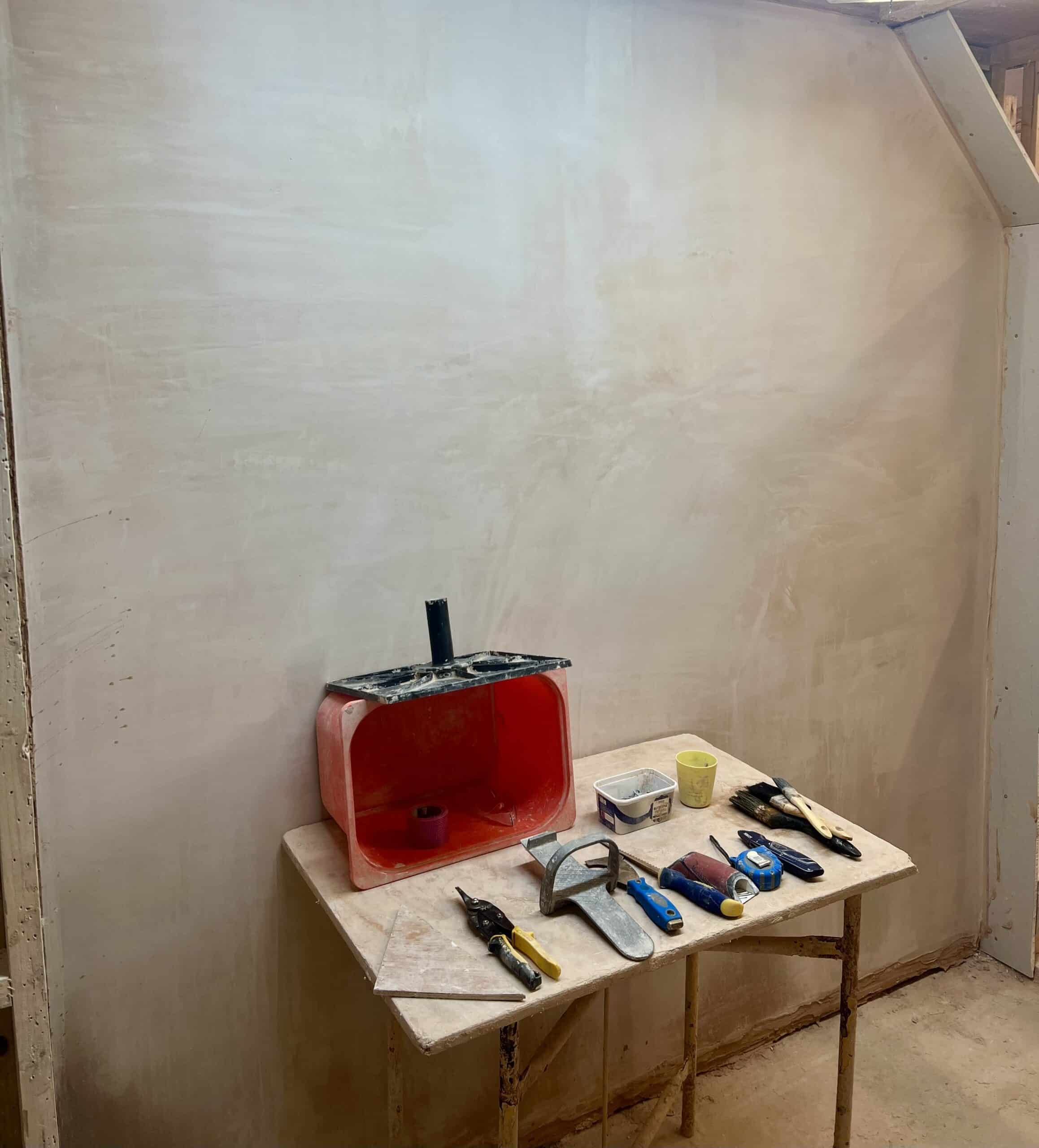 a plastered wall completed on day two of a plastering course