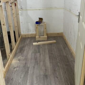 carpentry training bay with laminate floor and skirting installed