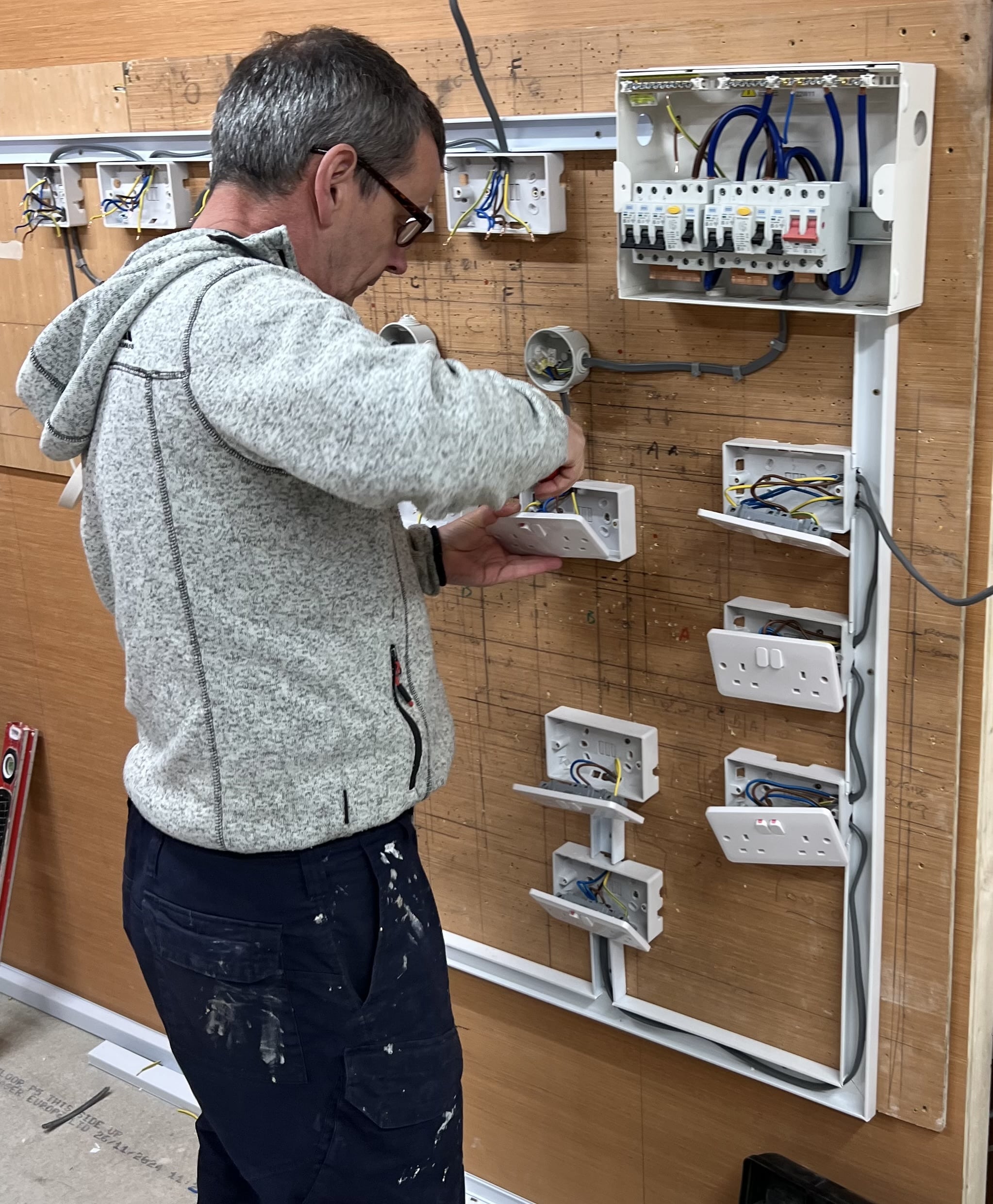 Person installing electrical circuits