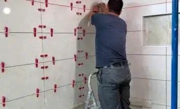 Student from Manchester completing expert tiling training on his course in Stoke-on-Trent