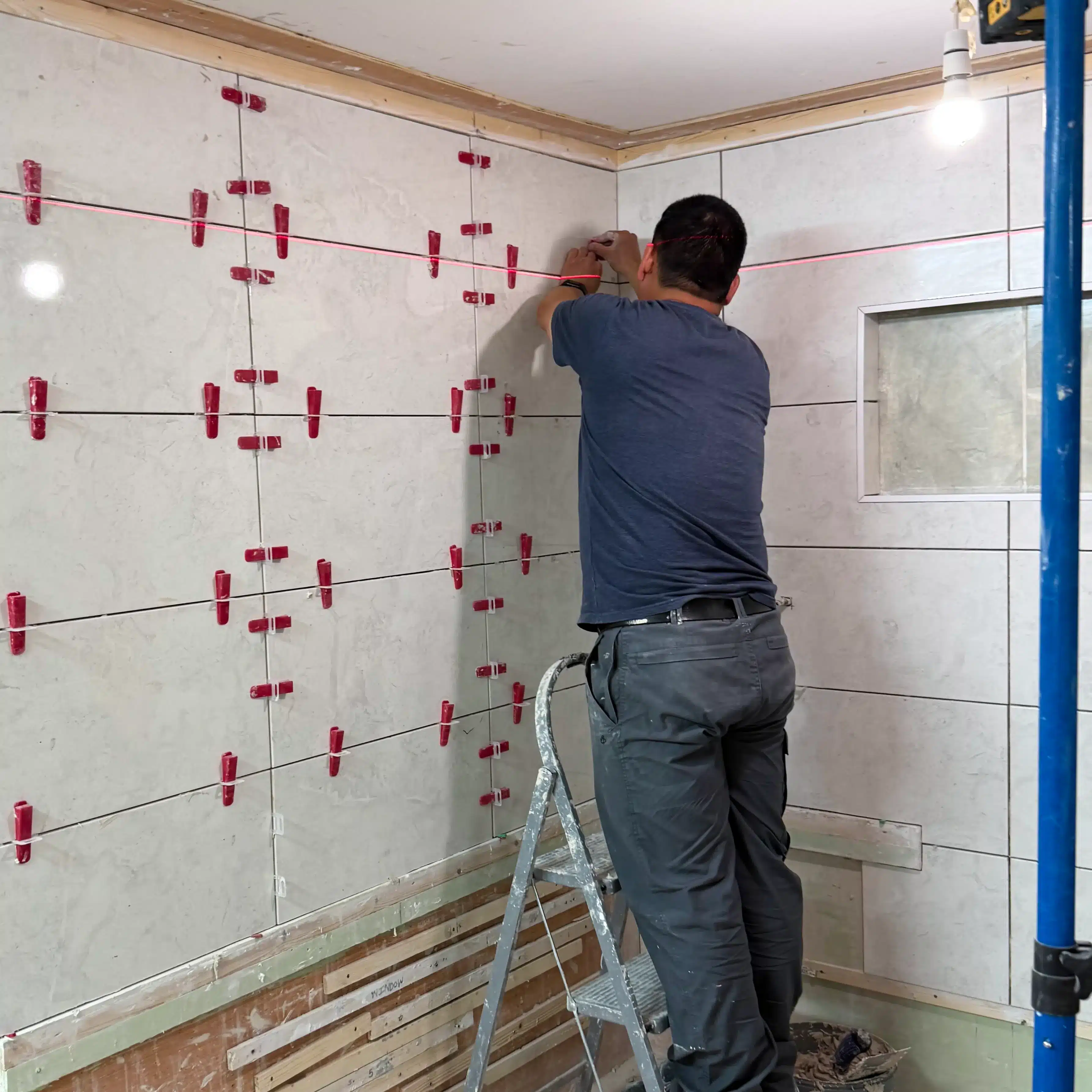 Student from Manchester completing expert tiling training on his course in Stoke-on-Trent