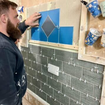 Person completing tiling course in Midlands