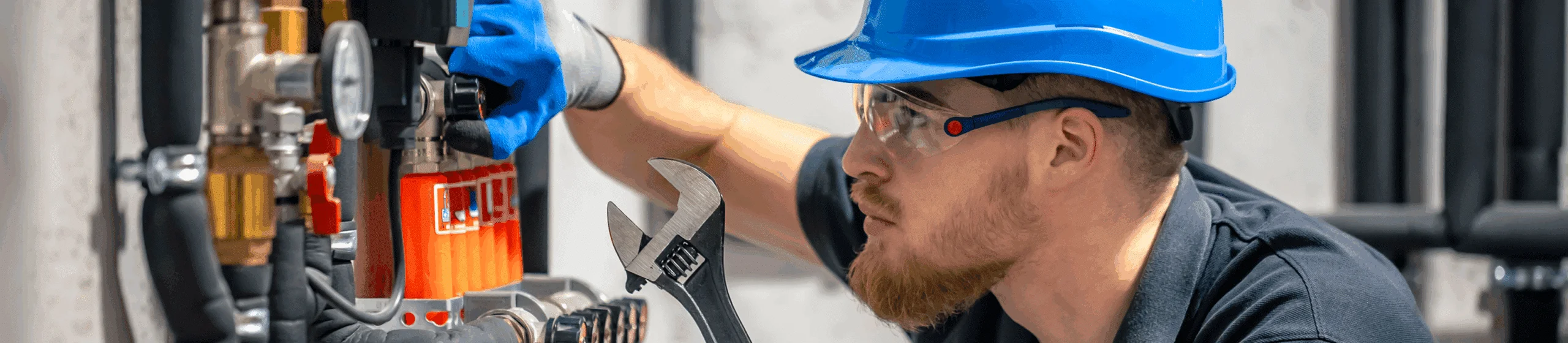 person working on a heating system jig